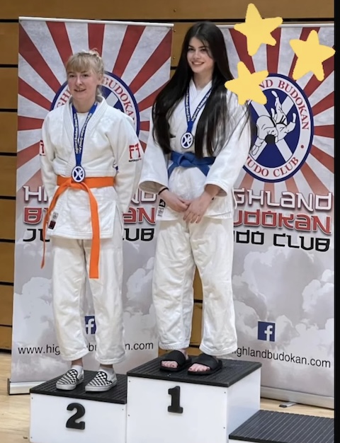 Imogen Clark on the podium at the Highland Budokan Grand Prix